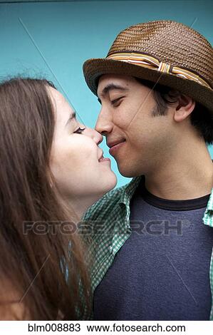 Stock Image - Happy couple smiling at one another. Fotosearch