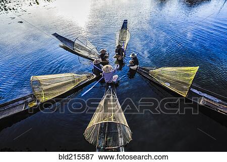 High angle view of Asian fishermen fishing in canoes on river View Large Photo Image Stock Photo - High angle view of Asian fishermen fishing in canoes on river. Fotosearch