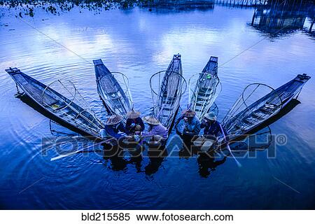 High angle view of Asian fishermen fishing in canoes on river View Large Photo Image Stock Photography - High angle view of Asian fishermen fishing in canoes on river. Fotosearch