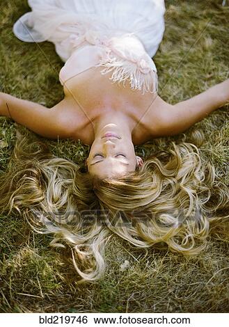 High angle view of bride laying in hay View Large Photo Image Stock Photograph - High angle view of bride laying in hay. Fotosearch