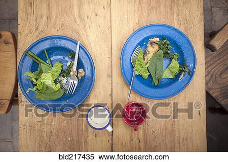 Stock Photography - High angle view of plates of greens on table. Fotosearch