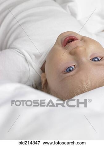 High angle view of smiling mixed race baby girl View Large Photo Image Stock Photo - High angle view of smiling mixed race baby girl. Fotosearch