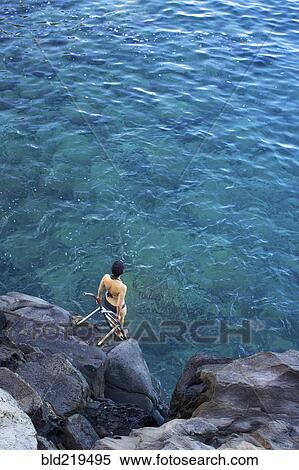 High angle view of woman climbing ladder into ocean View Large Photo Image Stock Photography - High angle view of woman climbing ladder into ocean. Fotosearch
