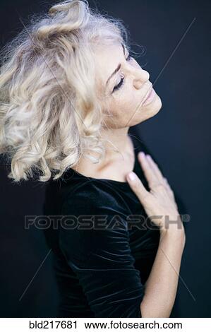 High angle view of woman with eyes closed View Large Photo Image Stock Image - High angle view of woman with eyes closed. Fotosearch