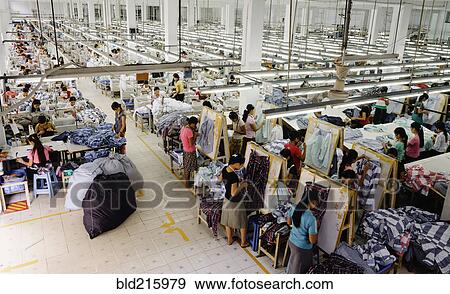 High angle view of workers in garment factory View Large Photo Image Stock Photo - High angle view of workers in garment factory. Fotosearch