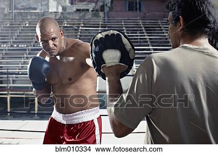Hispanic boxers sparring in gym View Large Photo Image Picture - Hispanic boxers sparring in gym. Fotosearch