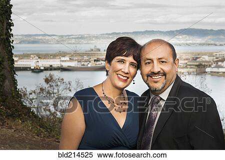 Hispanic couple hugging in formal wear View Large Photo Image Stock Photography - Hispanic couple hugging in formal wear. Fotosearch