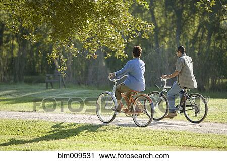 Hispanic couple riding bicycles View Large Photo Image Stock Image - Hispanic couple riding bicycles. Fotosearch