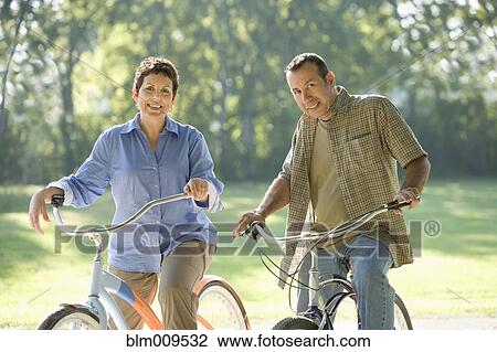 Hispanic couple riding bicycles View Large Photo Image Stock Image - Hispanic couple riding bicycles. Fotosearch