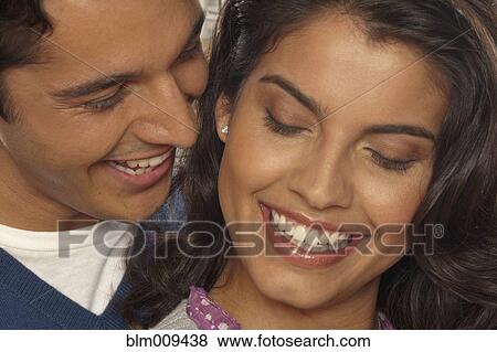 Stock Photo - Hispanic couple smiling. Fotosearch