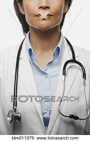 Hispanic doctor with bandages on mouth View Large Photo Image Stock Photo - Hispanic doctor with bandages on mouth. Fotosearch