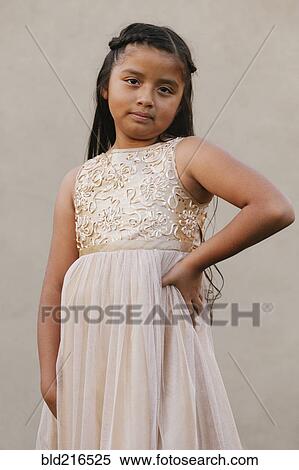 Hispanic girl wearing party dress View Large Photo Image Stock Photography - Hispanic girl wearing party dress. Fotosearch