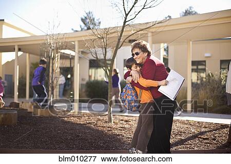 Hispanic grandmother hugging grandson View Large Photo Image Stock Photo - Hispanic grandmother hugging grandson. Fotosearch