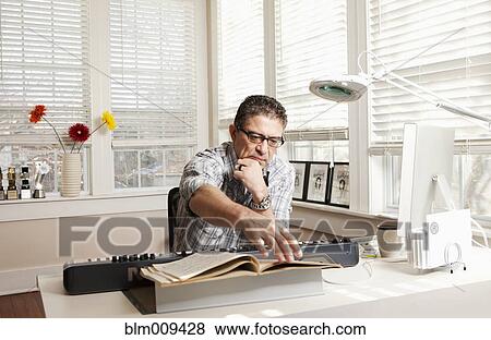 Hispanic man with electronic keyboard and sheet music View Large Photo Image Stock Photo - Hispanic man with electronic keyboard and sheet music. Fotosearch