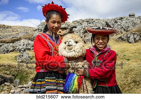 Hispanic sisters smiling with llama in rural landscape View Large Photo Image Stock Photo - Hispanic sisters smiling with llama in rural landscape. Fotosearch