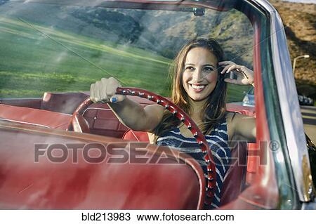 Hispanic woman driving in classic convertible View Large Photo Image Stock Image - Hispanic woman driving in classic convertible. Fotosearch
