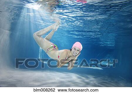 Hispanic woman in bikini swimming underwater View Large Photo Image Stock Image - Hispanic woman in bikini swimming underwater. Fotosearch
