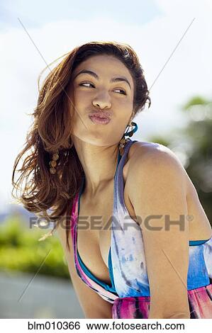 Hispanic woman puckering lips View Large Photo Image Stock Photograph - Hispanic woman puckering lips. Fotosearch