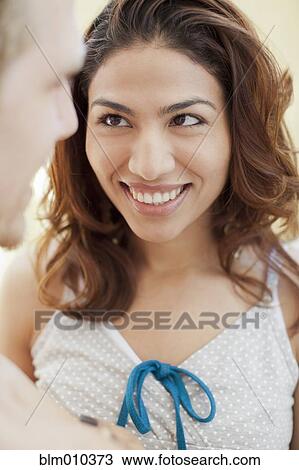Hispanic woman smiling at boyfriend View Large Photo Image Stock Image - Hispanic woman smiling at boyfriend. Fotosearch