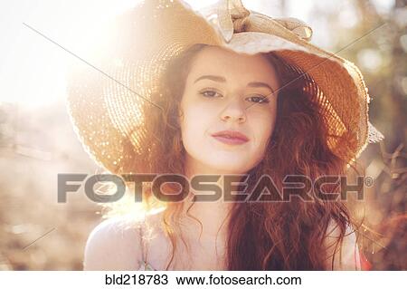 Hispanic woman wearing sun hat outdoors View Large Photo Image Stock Image - Hispanic woman wearing sun hat outdoors. Fotosearch
