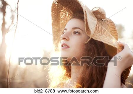 Hispanic woman wearing sun hat outdoors View Large Photo Image Stock Photo - Hispanic woman wearing sun hat outdoors. Fotosearch