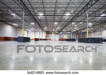 Infrastructure and lighting in empty warehouse View Large Photo Image Stock Image - Infrastructure and lighting in empty warehouse. Fotosearch