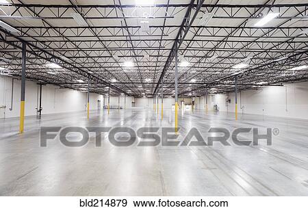 Infrastructure and lighting in empty warehouse View Large Photo Image Stock Photo - Infrastructure and lighting in empty warehouse. Fotosearch