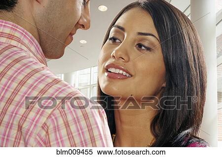 Stock Photography - Intimate Hispanic couple. Fotosearch