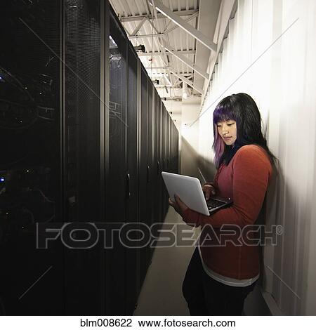Japanese businesswoman using laptop on office technology room View Large Photo Image Stock Image - Japanese businesswoman using laptop on office technology room. Fotosearch