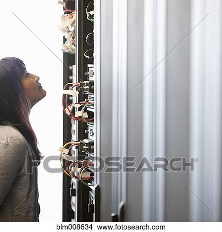 Japanese businesswoman working in office technology room View Large Photo Image Picture - Japanese businesswoman working in office technology room. Fotosearch