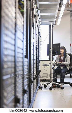 Japanese businesswoman working in office technology room View Large Photo Image Stock Image - Japanese businesswoman working in office technology room. Fotosearch
