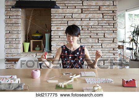 Japanese woman wrapping gifts View Large Photo Image Stock Photography - Japanese woman wrapping gifts. Fotosearch