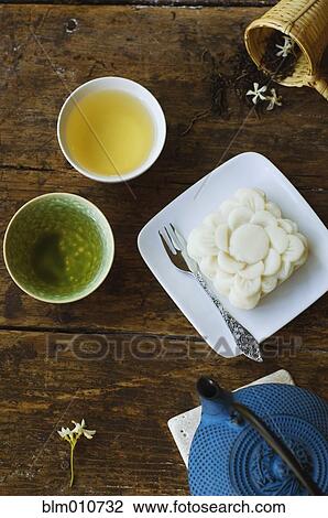 Jasmine tea and rice cake View Large Photo Image Stock Image - Jasmine tea and rice cake. Fotosearch
