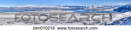 Stock Photograph - Lake and snow covered field. Fotosearch