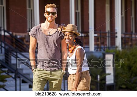 Laughing couple walking outdoors View Large Photo Image Stock Photo - Laughing couple walking outdoors. Fotosearch