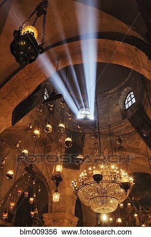 Stock Photograph - Light shining through church roof window. Fotosearch