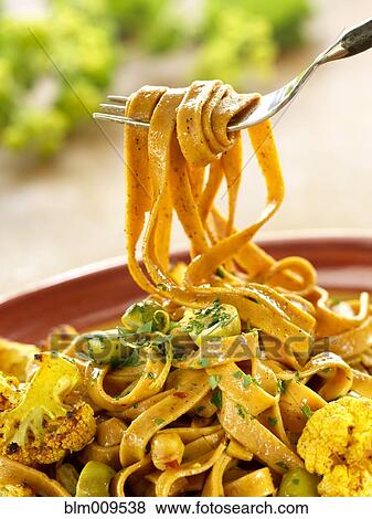 Stock Photo - Linguini pasta with chipotle and chickpeas. Fotosearch