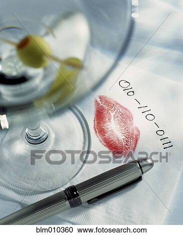Stock Image - Lipstick print and phone number on napkin. Fotosearch