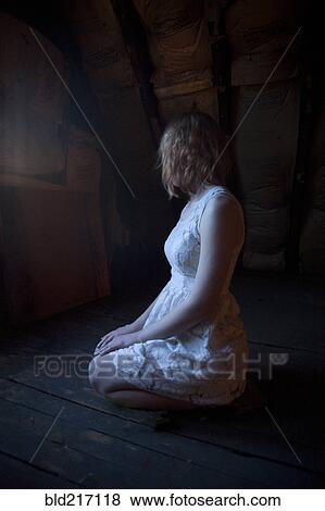 Lonely Caucasian woman sitting on floor View Large Photo Image Stock Photo - Lonely Caucasian woman sitting on floor. Fotosearch