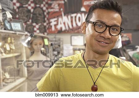 Malaysian man in vintage store View Large Photo Image Stock Image - Malaysian man in vintage store. Fotosearch