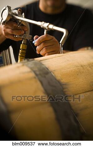 Man pouring water into wooden keg View Large Photo Image Stock Photo - Man pouring water into wooden keg. Fotosearch