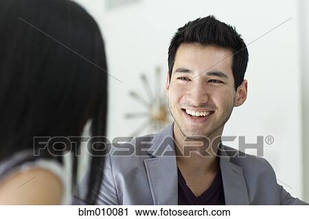 Man smiling at girlfriend View Large Photo Image Stock Image - Man smiling at girlfriend. Fotosearch