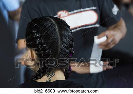 Man wrapping hand near Caucasian girl wearing braids View Large Photo Image Stock Image - Man wrapping hand near Caucasian girl wearing braids. Fotosearch