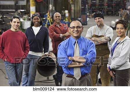 Manager and workers standing in factory View Large Photo Image Picture - Manager and workers standing in factory. Fotosearch
