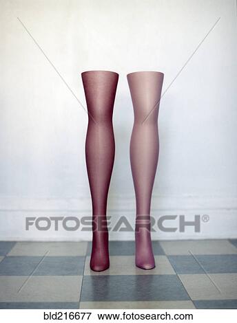 Stock Photo - Mannequin legs standing on tiled floor. Fotosearch