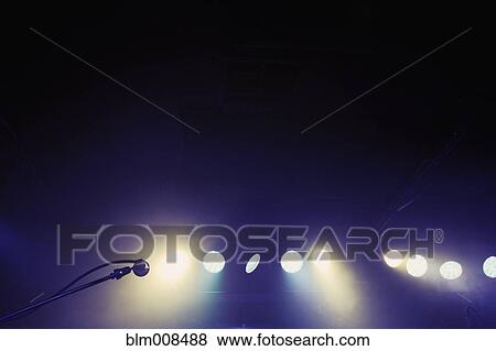 Microphone and spotlights on stage View Large Photo Image Stock Photo - Microphone and spotlights on stage. Fotosearch