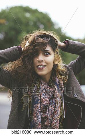 Middle Eastern woman tossing her hair outdoors View Large Photo Image Stock Image - Middle Eastern woman tossing her hair outdoors. Fotosearch