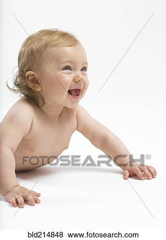 Stock Photo - Mixed race baby girl crawling on floor. Fotosearch