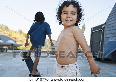 Mixed race children playing outdoors View Large Photo Image Stock Image - Mixed race children playing outdoors. Fotosearch