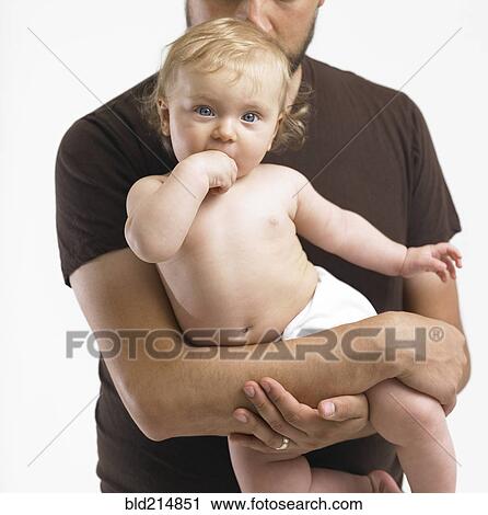 Mixed race father holding baby girl View Large Photo Image Stock Image - Mixed race father holding baby girl. Fotosearch